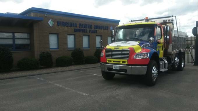 The Autism Speaks dump truck in front of Virginia Paving Company.